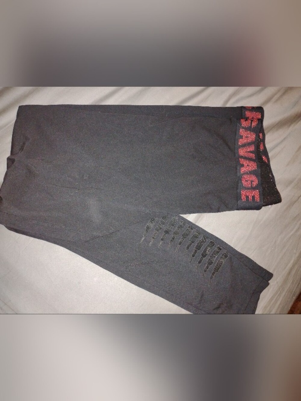 Fenty Savage - Black Slim Joggers with Unique Distressed Calf Detailing